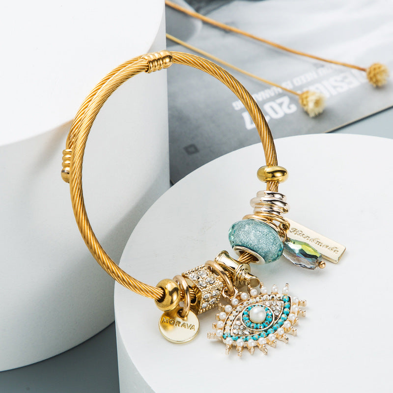Bracelet œil avec cristal et détails plaqués or