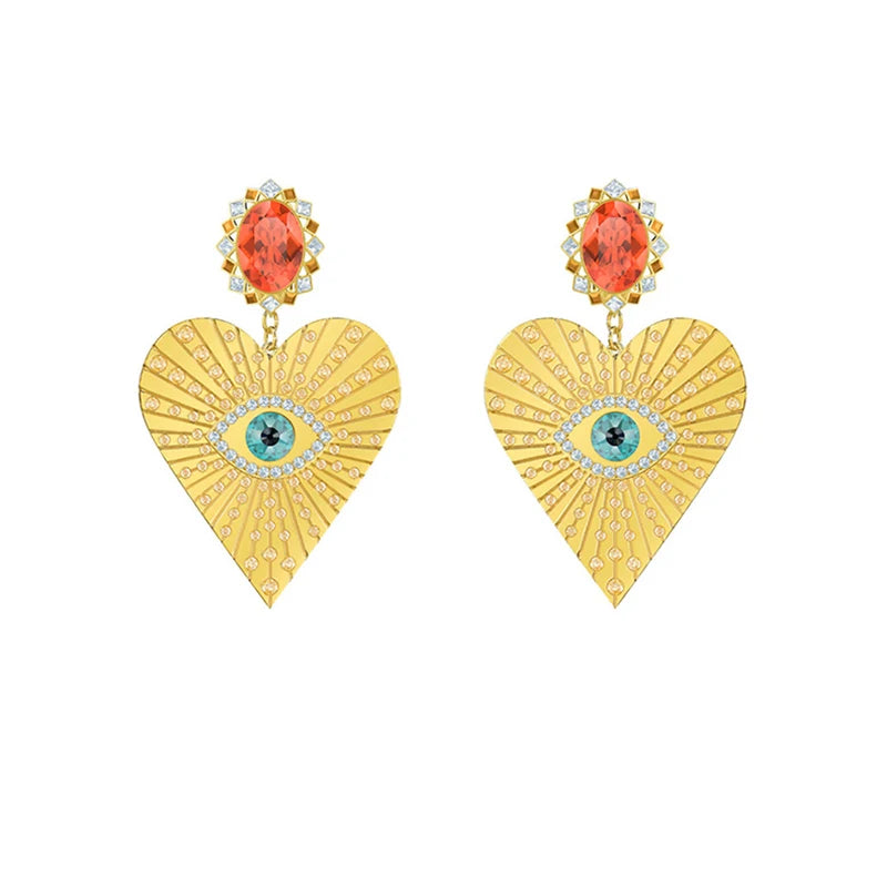 Boucles d’oreilles dorées avec pierre décorative