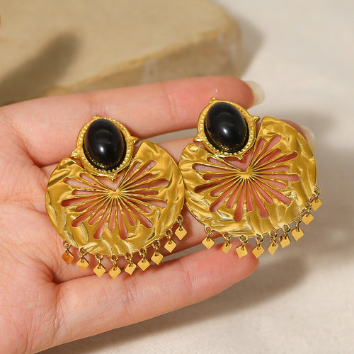 Boucles d’oreilles dorées géométriques en acier titane