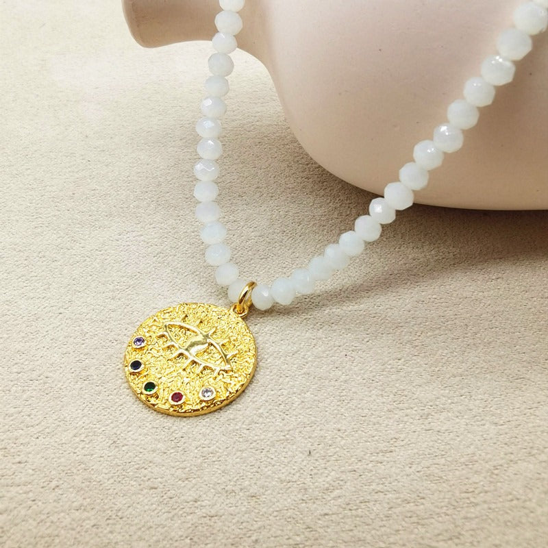 Collier de perles d’eau douce avec motif œil