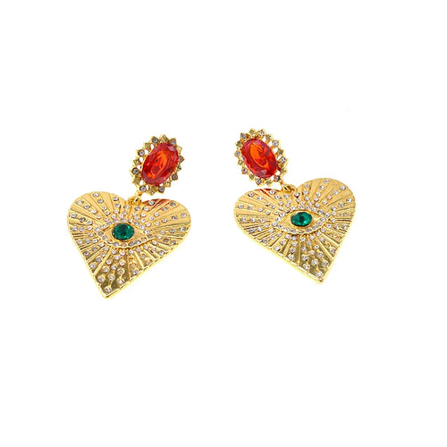 Boucles d’oreilles dorées avec pierre décorative