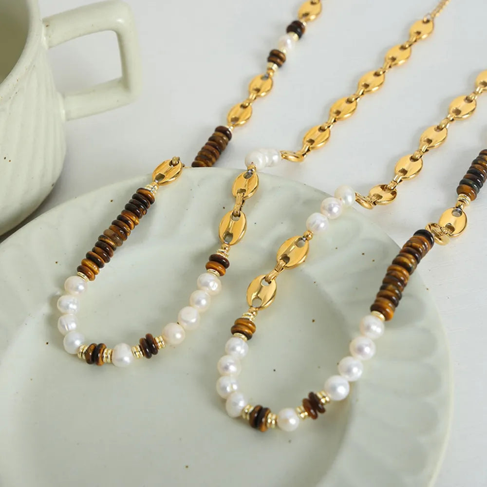 Collier doré perle et œil-de-tigre