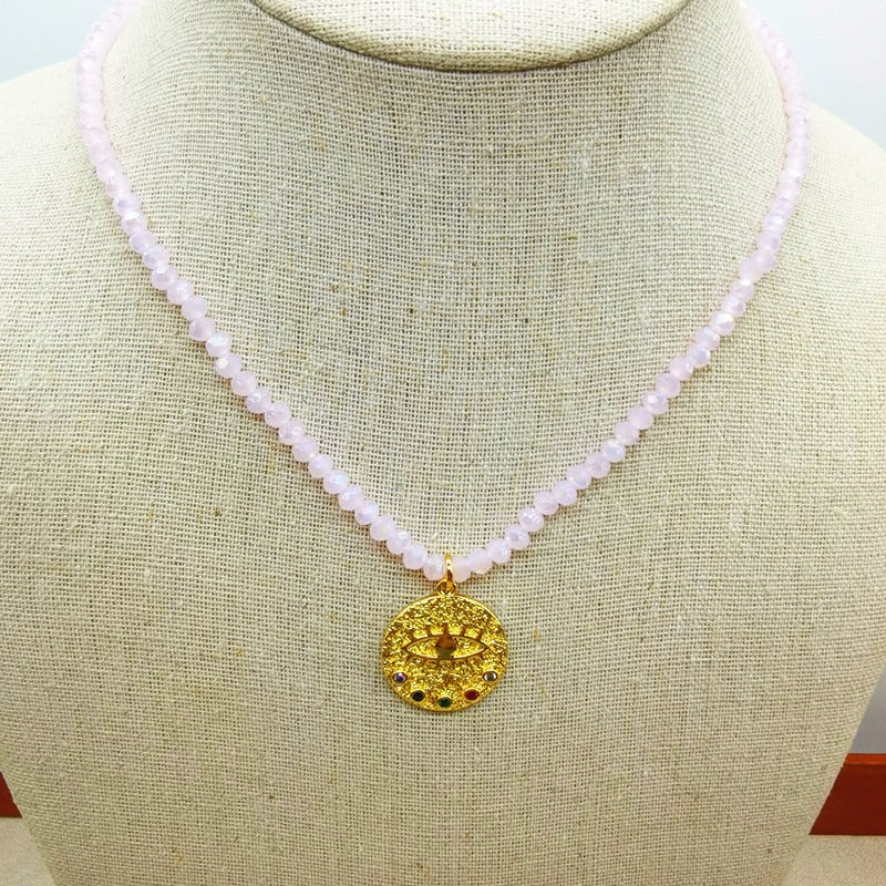 Collier de perles d’eau douce avec motif œil