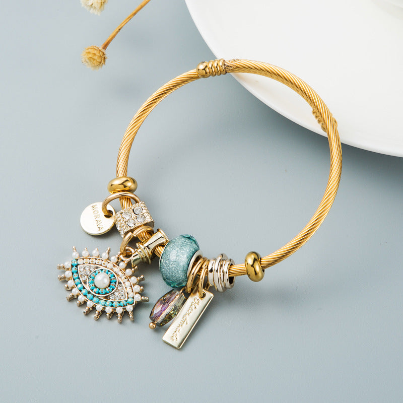 Bracelet œil avec cristal et détails plaqués or