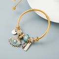 Bracelet œil avec cristal et détails plaqués or