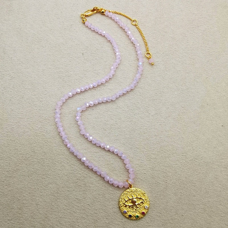 Collier de perles d’eau douce avec motif œil