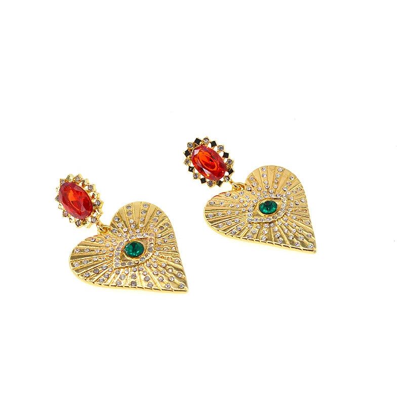 Boucles d’oreilles dorées avec pierre décorative