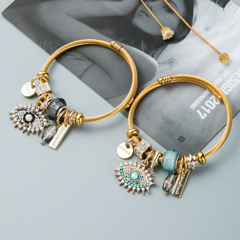 Bracelet œil avec cristal et détails plaqués or
