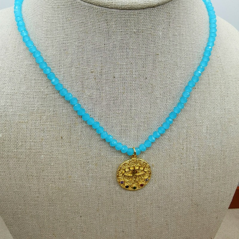 Collier de perles d’eau douce avec motif œil