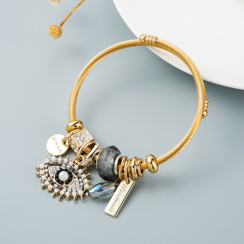Bracelet œil avec cristal et détails plaqués or