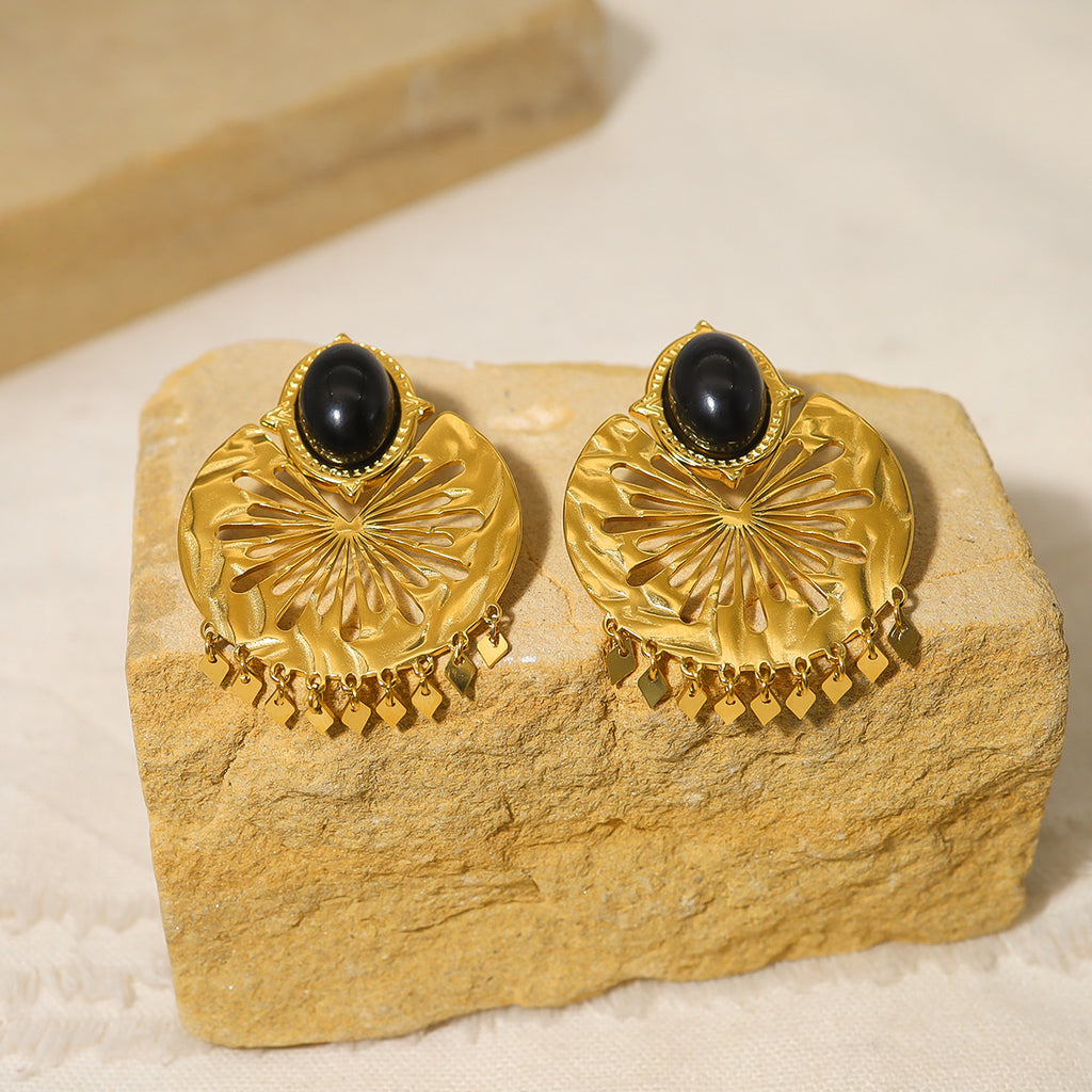Boucles d’oreilles dorées géométriques en acier titane