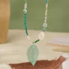 Collier doré coquillage, perle et jade